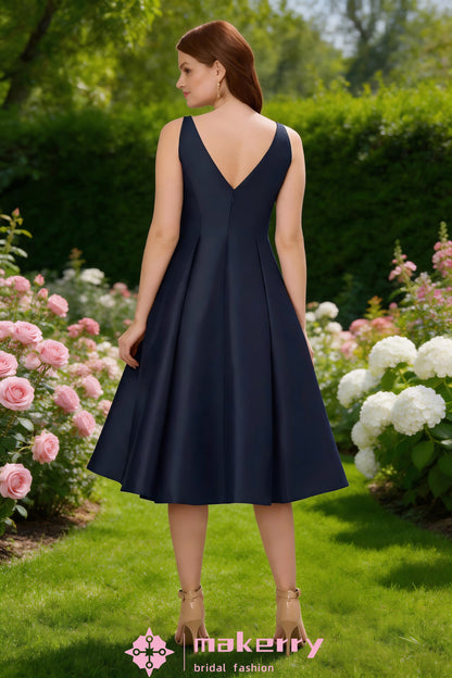 Tea Length Dress features A Classic Boat Neckline And A Pleated Flare Skirt