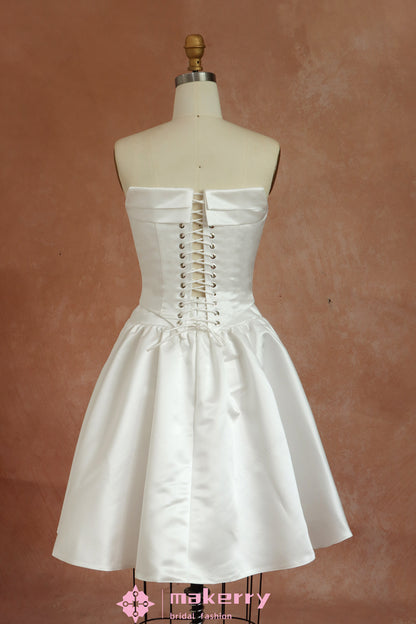 Mini Bridal Dress With A Structured Corset Bodice And Pleated Skirt