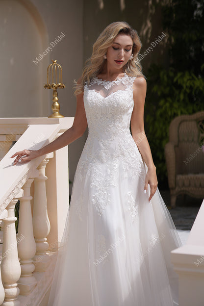 The Soft Tulle A-Line Wedding Dress Has An Illusion Neckline And Sheer Back