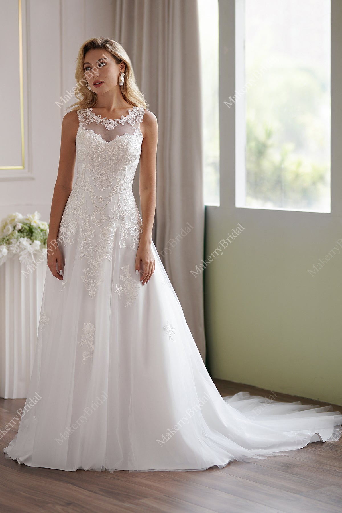 The Soft Tulle A-Line Wedding Dress Has An Illusion Neckline And Sheer Back