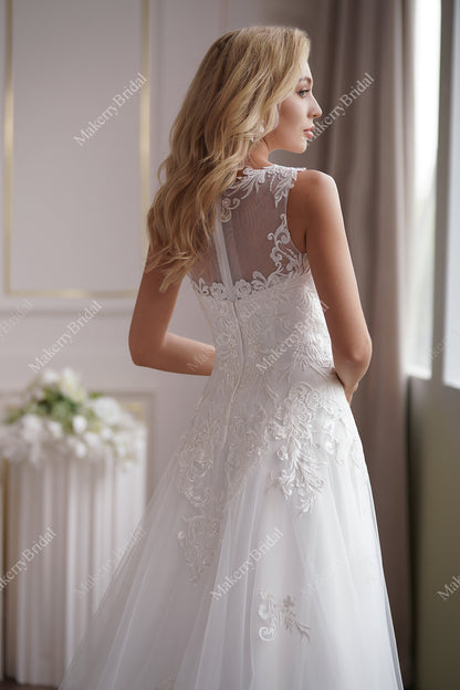 The Soft Tulle A-Line Wedding Dress Has An Illusion Neckline And Sheer Back