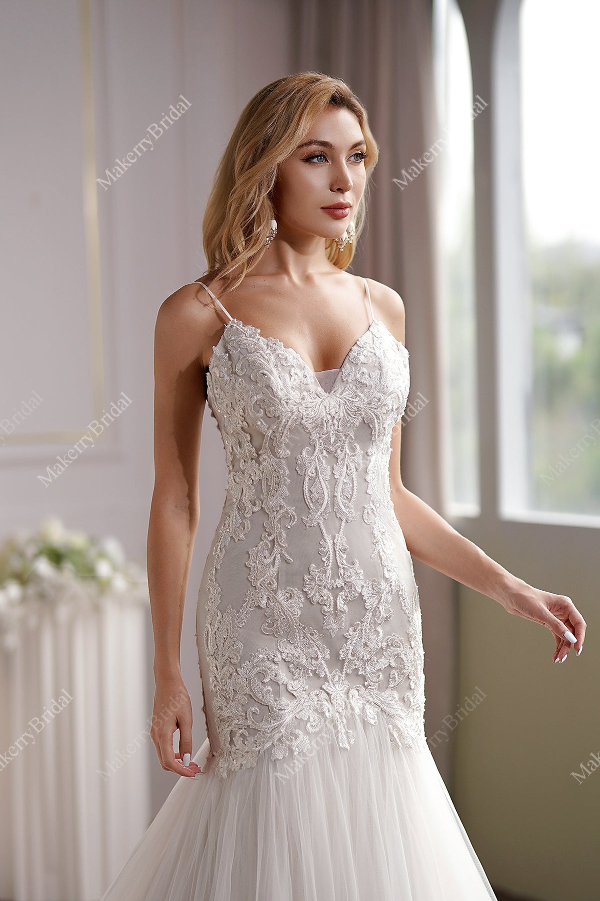 Curve-hugging beaded lace mermaid wedding gown with breathtaking illusion back