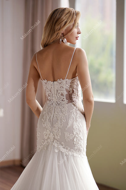 Curve-hugging beaded lace mermaid wedding gown with breathtaking illusion back