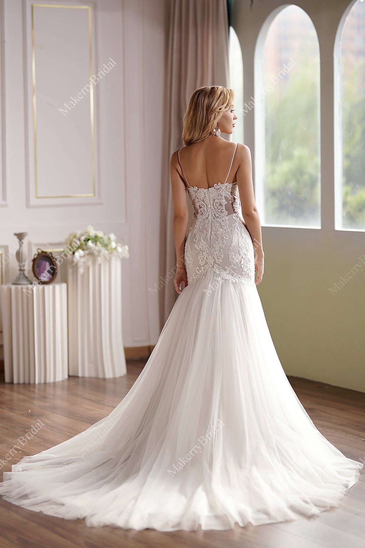 Curve-hugging beaded lace mermaid wedding gown with breathtaking illusion back