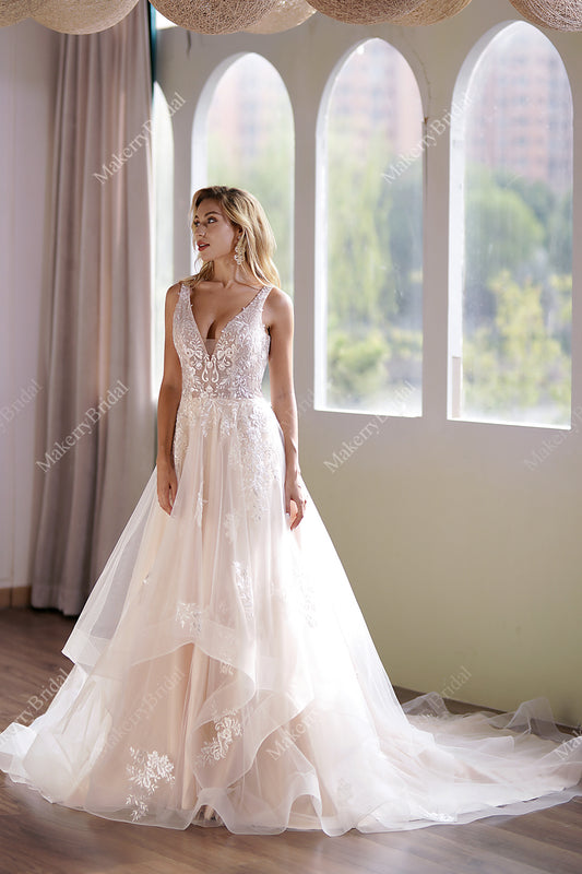 This Ball Gown Has A Sleeveless Bodice And A V-Neck Neckline