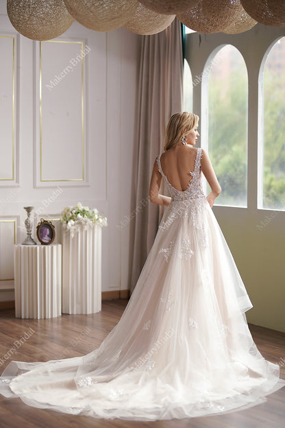 This Ball Gown Has A Sleeveless Bodice And A V-Neck Neckline