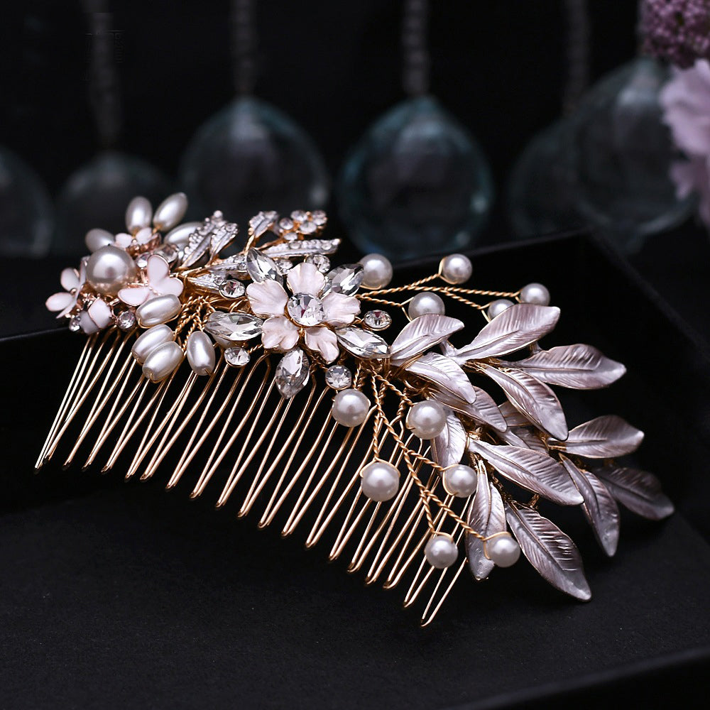 Gold hair comb with flower and leaves