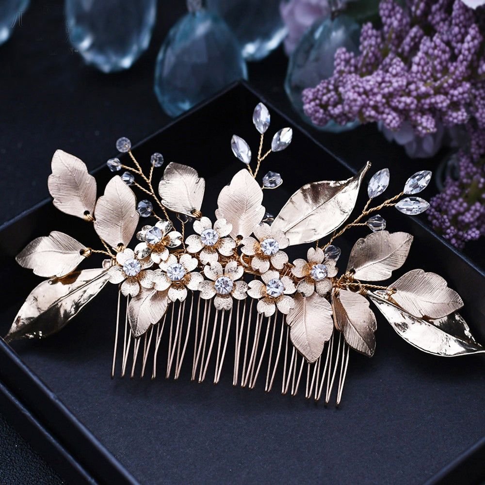 Ornate gold flower leaf bridal comb