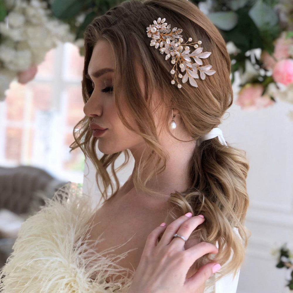 Gold hair comb with flower and leaves