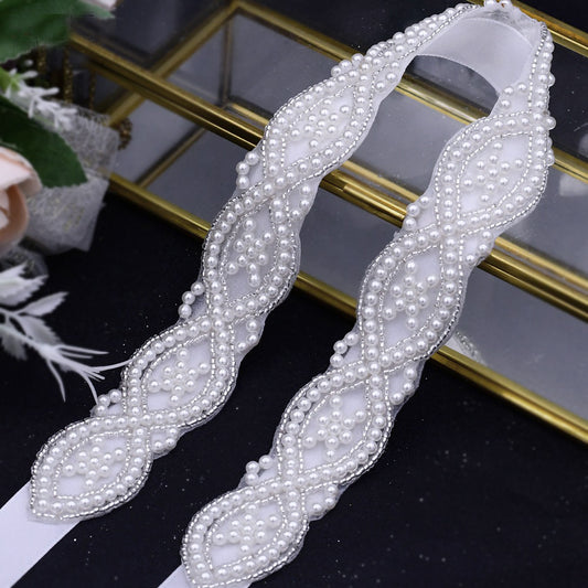 Beaded pearls wedding belt on the wedding dress